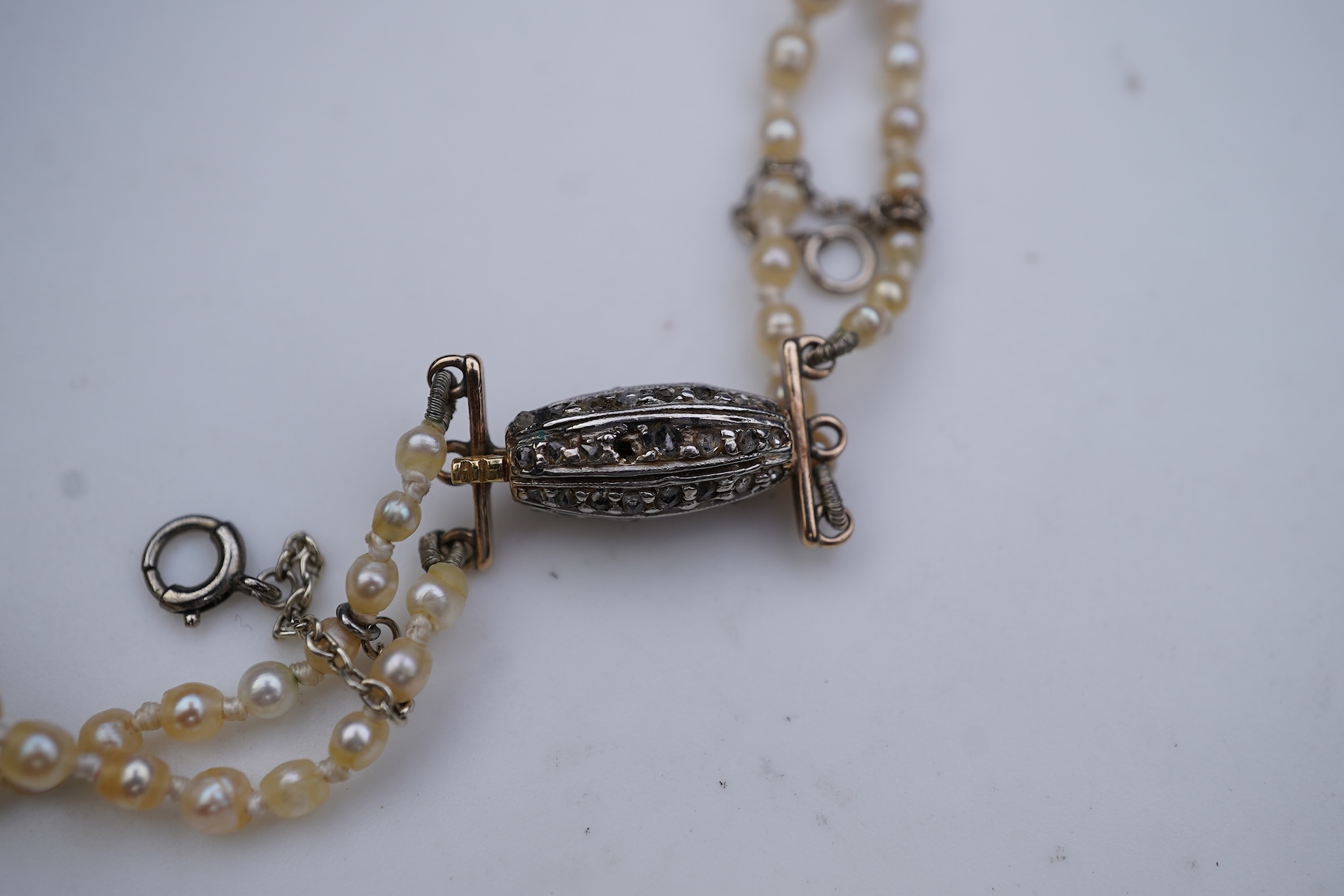 A natural pearl and diamond necklace, early 20th century